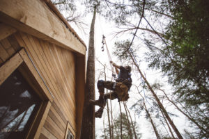 man building tree house