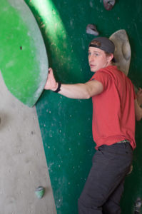 man on rock climbing wall