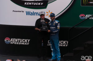 Martin Truex Jr being awarded the poll position (Photo by Austin Johnson/Ace Weekly)