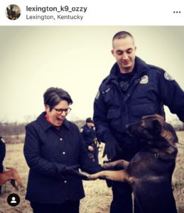 Lexington Community Corrections: a woman and a police officer with a dog