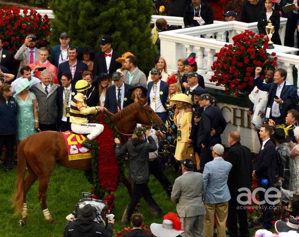 Kentucky Derby: a horse and a jockey in the winners circle at the derby
