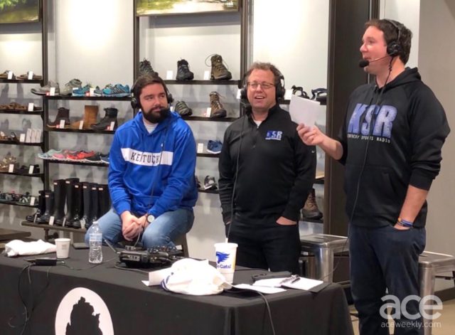 KSR: three guys in black and blue hoodies with headphones