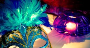 mardi gras mask with blue, yellow, purple colors