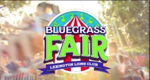 a logo that says Bluegrass Fair with a light hazy picture behind it