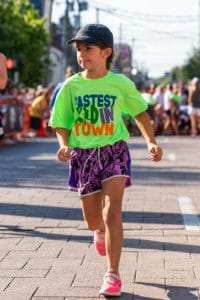 girl in a bright shirt running