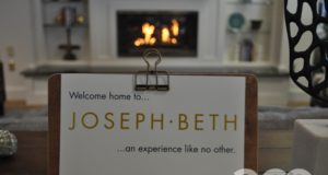 sign that says Joseph-Beth and a fireplace behind