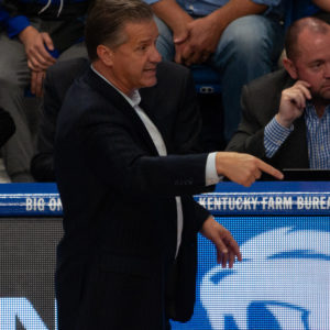 basketball: calipari in a suit talking to someone
